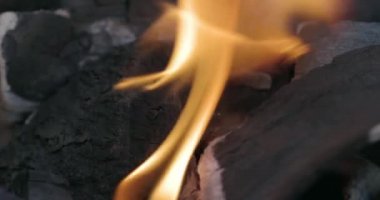 Close-up coal burn in the fire in slow motion. Coal is starting to burn. Super Slow motion video.