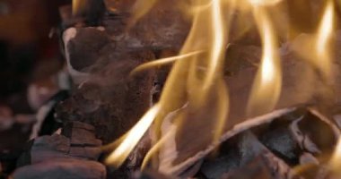 Close-up coal burn in the fire in slow motion. Coal is starting to burn. Super Slow motion video.