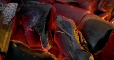 Close-up coal burn in the fire in slow motion. Coal is starting to burn. Super Slow motion video.