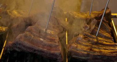 Grilled pork ribs on a flaming grill  with temperature sensors. Ribs on flaming grill barbecued.