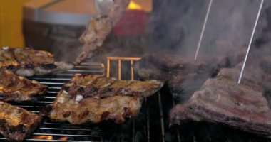 Grilled pork ribs on a flaming grill  with temperature sensors. Ribs on flaming grill barbecued.