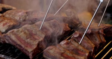 Grilled pork ribs on a flaming grill  with temperature sensors. Ribs on flaming grill barbecued.