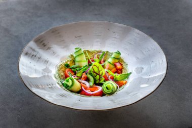 Fresh salad with cucumbers and tomatoes. Salad with lettuce and fresh vegetable close up.