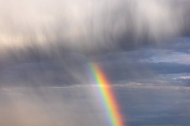 Rainbow colorful sunset on blue pink sky yellow clouds skyline. blue sky with white clouds - perfect for sky replacement