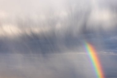 Rainbow colorful sunset on blue pink sky yellow clouds skyline. blue sky with white clouds - perfect for sky replacement