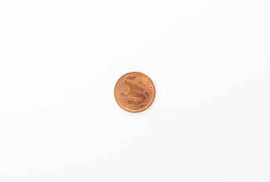 Brazilian Real - BRL. Dinheiro, Brasil, Reais, moeda. Photograph of a brazilian coins on a brazilian banknotes.