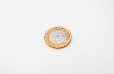 Brazilian Real - BRL. Dinheiro, Brasil, Reais, moeda. Photograph of a brazilian coins on a brazilian banknotes.