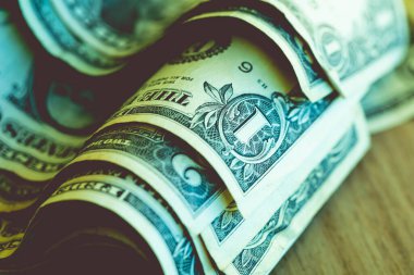 One dollar banknote closeup shot in low light environment. Economy and finance.