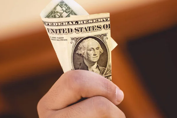 Young Man Holding His Hand Folded One Dollar Bill — Foto de Stock