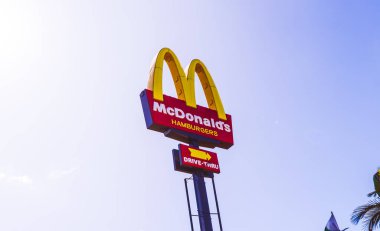McDonald's Hamburguers. McDonald's Restaurant plate with the background of beautiful clouds and bluish sky. So Paulo - Brazil. April, 18, 2019.