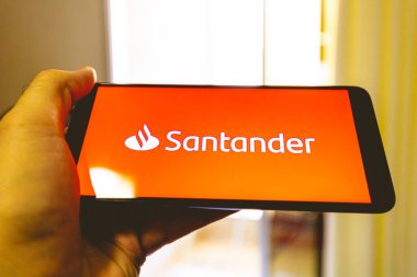 Brasilia, Federal district - Brazil. 2022. Santander bank logo on the phone screen