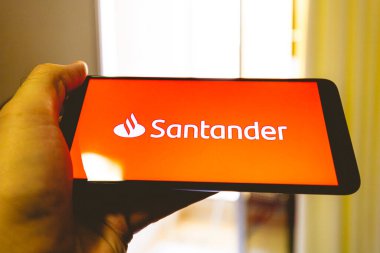 Brasilia, Federal district - Brazil. 2022. Santander bank logo on the phone screen