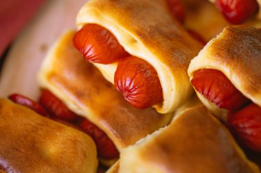 Hot dog baked with bread dough (Syrian hot dog) or sausage roll in bread dough. Traditional salted in Brazil. Brazilian food. Hot dog.