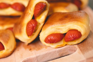 Hot dog baked with bread dough (Syrian hot dog) or sausage roll in bread dough. Traditional salted in Brazil. Brazilian food. Hot dog.