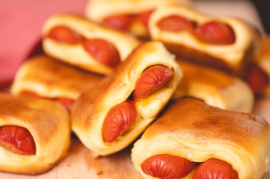 Hot dog baked with bread dough (Syrian hot dog) or sausage roll in bread dough. Traditional salted in Brazil. Brazilian food. Hot dog.