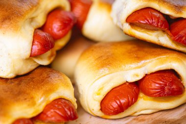 Hot dog baked with bread dough (Syrian hot dog) or sausage roll in bread dough. Traditional salted in Brazil. Brazilian food. Hot dog.