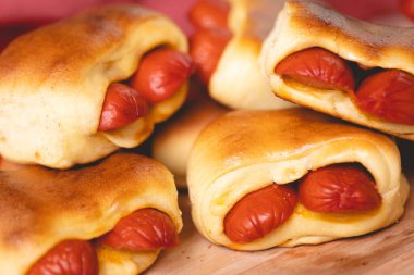 Hot dog baked with bread dough (Syrian hot dog) or sausage roll in bread dough. Traditional salted in Brazil. Brazilian food. Hot dog.