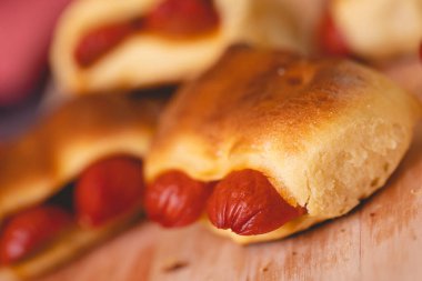 Hot dog baked with bread dough (Syrian hot dog) or sausage roll in bread dough. Traditional salted in Brazil. Brazilian food. Hot dog.