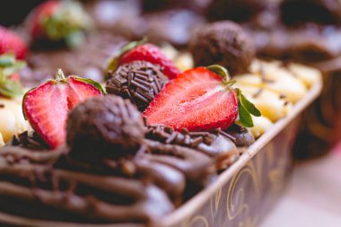 Delicious chocolate cakes decorate with red strawberries