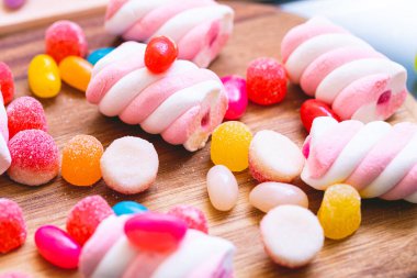 assorted candy on a wooden board