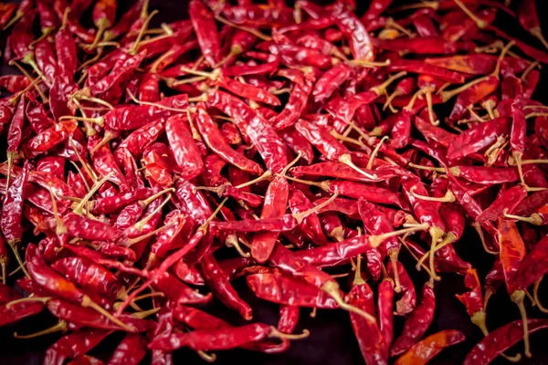 Dry chilli peppers,spicy seasoning,lot of dried chili as a food background,Dried red peppers on a wooden table,red dry Chili pepper background,Dry paprika hd footage