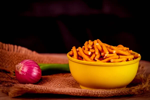 Gujarati local food Gadhiya with green pepper chili on wooden table,Chivda, Farsan, Namkin,