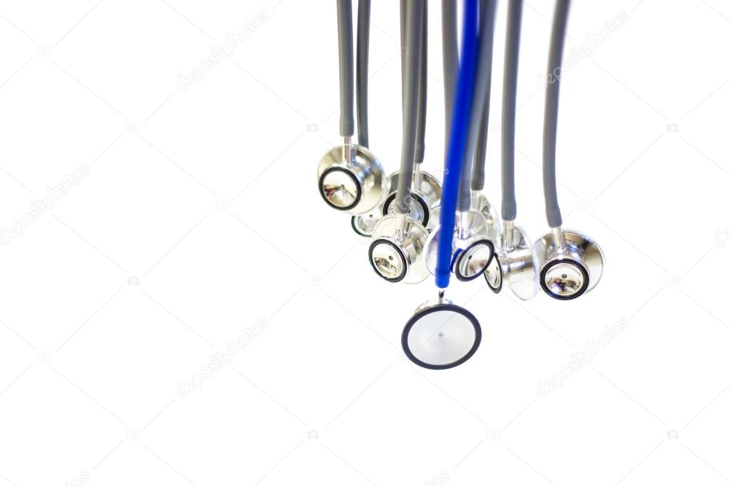 abstract of a group of gray stethoscopes and one blue stethoscop