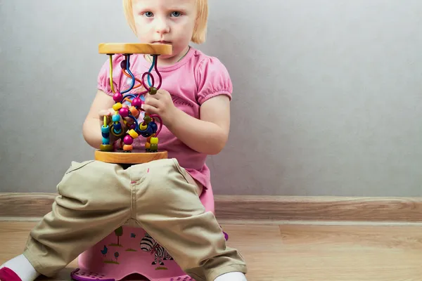 Small girl sits on a potty — Stock Photo, Image