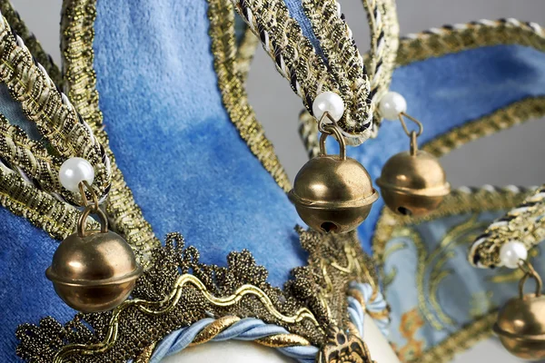 closeup Blue Venetian mask with metal bells