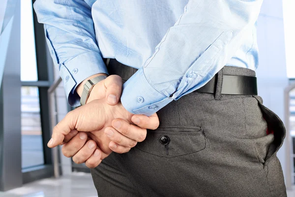 Businessman  standing  with   hands behind — Stock Photo, Image