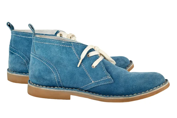 Een paar blauwe suède schoenen met witte veters geïsoleerd op een whi — Stockfoto