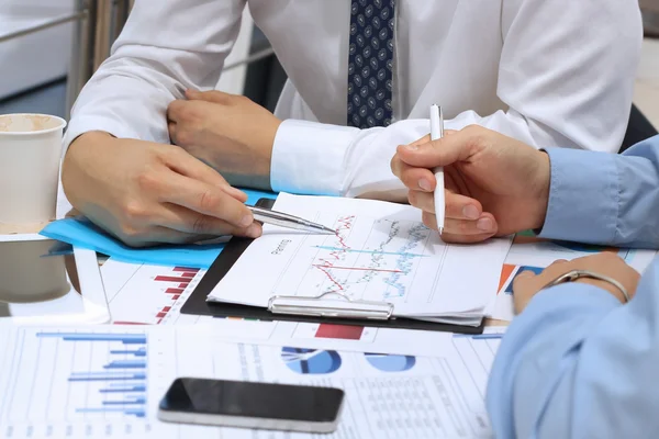 Business colleagues working together and analyzing financial fig — Stock Photo, Image