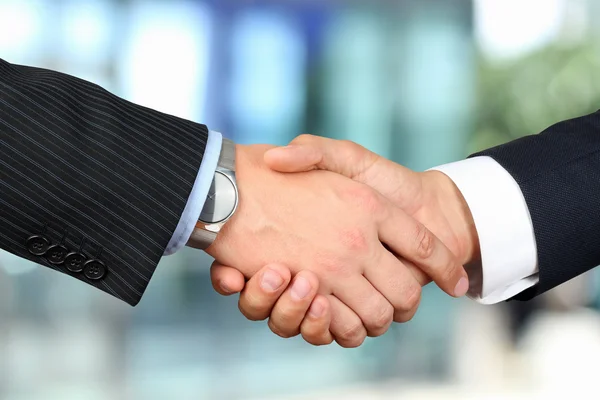 Close-up image of a firm handshake  between two colleagues outsi — Stock Photo, Image