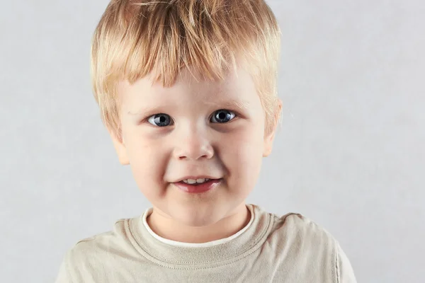 Funny Blond Boy Looking At Camera One Outdoor Stock Photo