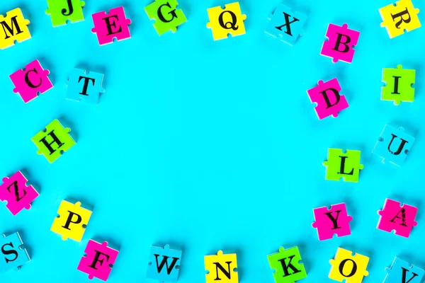 Top view of english alphabet from multi-colored puzzles Simulator for learning Russian. Образовательный процесс. Школа — стоковое фото