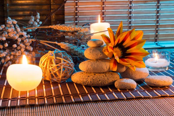 Candles, white stones, dried flowers, cinnamon, oil — Stock Photo, Image