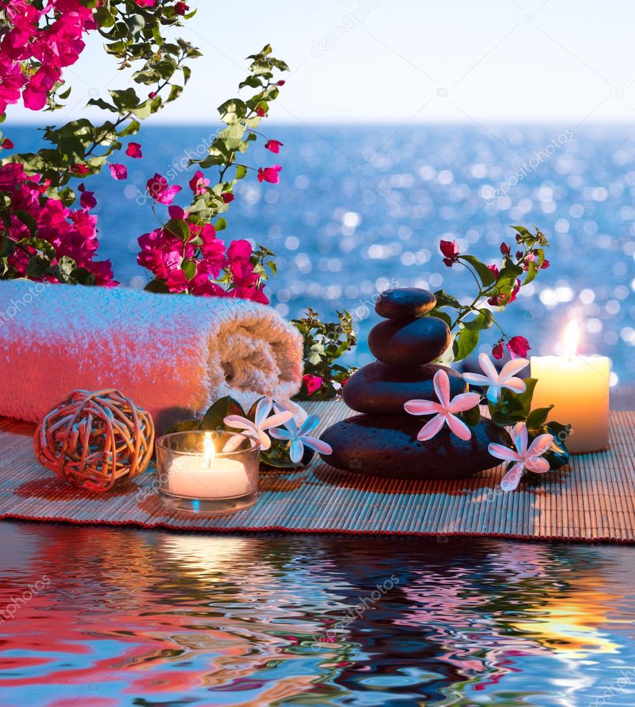 Candles - black stones and tiare - Bougainvillea on water