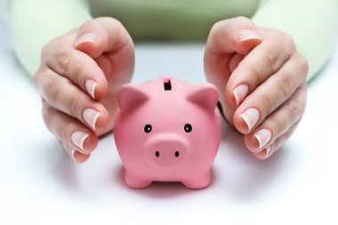Protect your savings - with hands and piggy bank clipart
