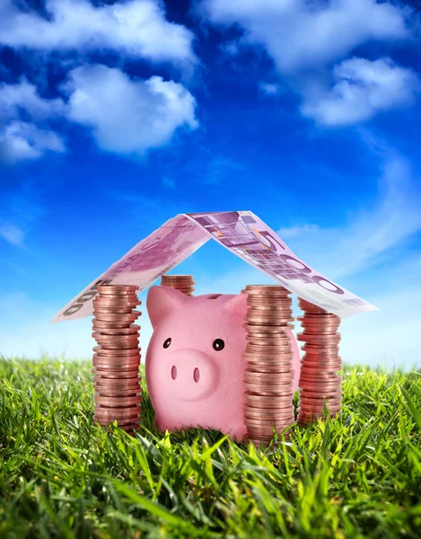 Put your savings safe - Piggybank in the home of Savings under the serenity sky