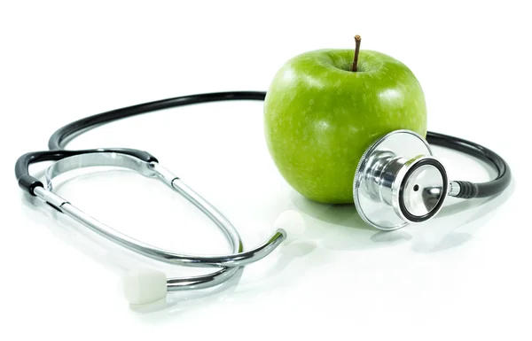 Protect your health with healthy nutrition.Stethoscope, apple — Stock Photo, Image