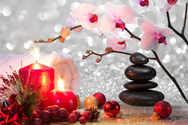 Massage composition christmas spa with candles, orchid, stones — Stock Photo, Image