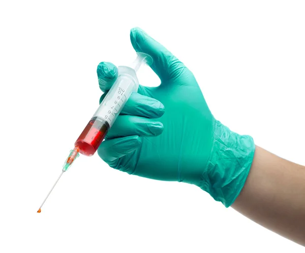 Main avec seringue à gants verts pour préparations injectables — Photo