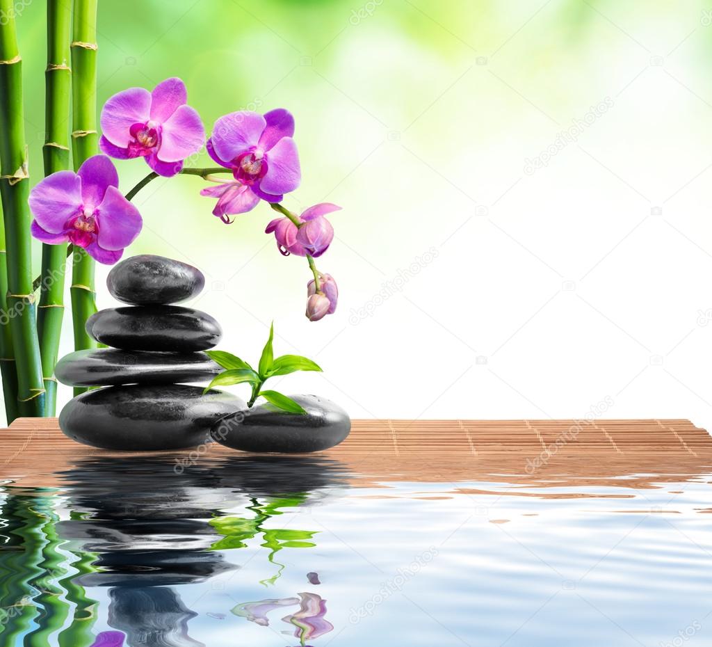 Spa background with bamboo , orchids and water