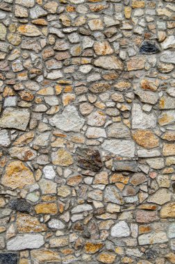 Kalenin yanından geçiyordum ve taştan yapılmış bir duvarın fotoğrafını çekmekten kendimi alamadım. Farklı boyutlarda, dağınık güneş ışığında çekilmiş bir duvar..