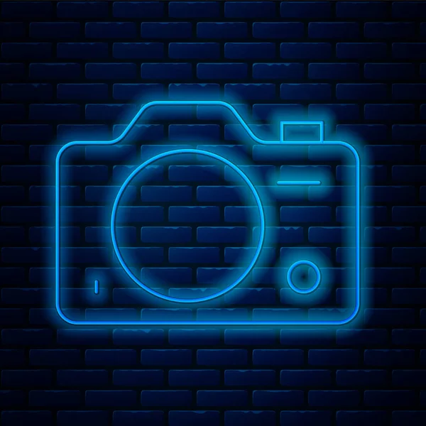 Glowing neon line Photo camera icon isolated on brick wall background. Foto camera. Digital photography. Vector — Stock Vector