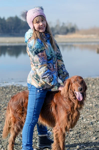 Girl riding a dog. — Stock Photo, Image