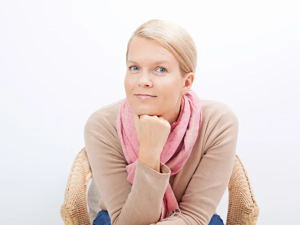 Woman sitting on a chair Royalty Free Stock Images