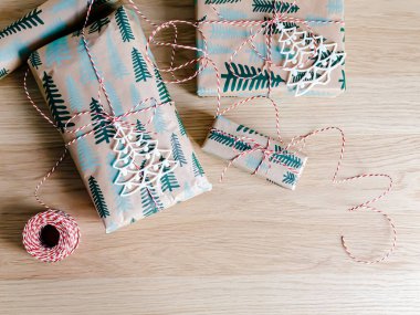 Gift boxes with minimalist style wrapping design. The concept of celebration events and wrapping gifts. Flat lay, top view. Merry Christmas and Happy New Year!