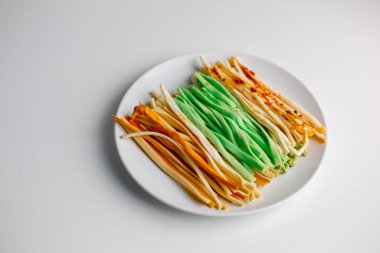 Assorted brined string hard cheese with adjika and wasabi