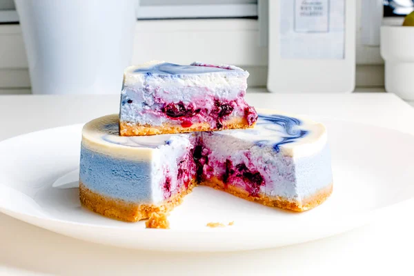 Piece Blue White Cheesecake Blueberry Cherry Black Currant Sauce White — Stockfoto